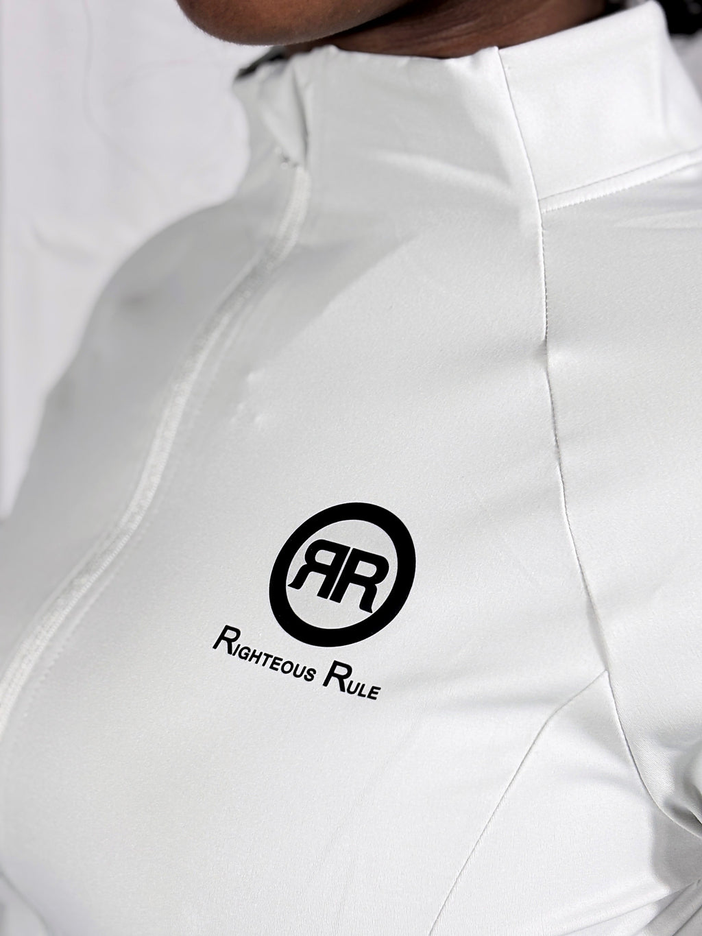 Close-up of the printed RR circle logo on The Standard Jacket in Pearl Grey